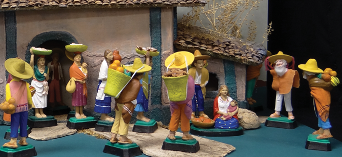 Mexican nativity with large yellow sombreros and festive colors