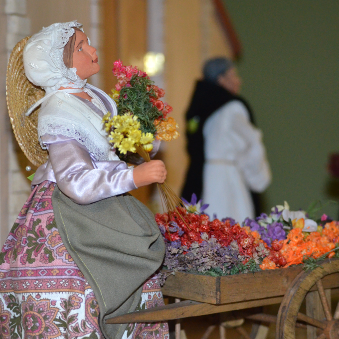young woman with a cart of flowers