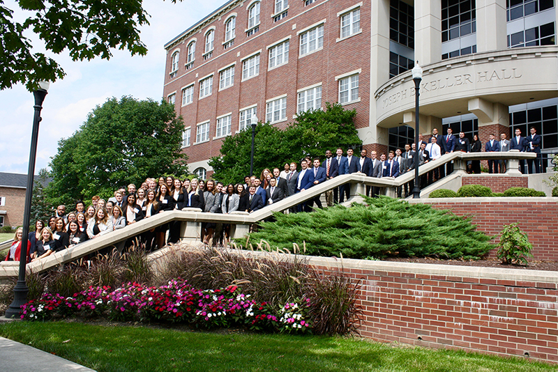 Students on the front steps of Keller Hall