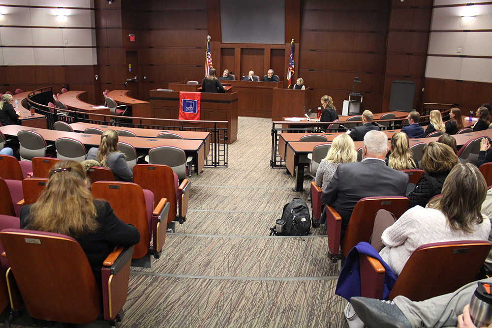 Wide image of student during Moot Court Competition