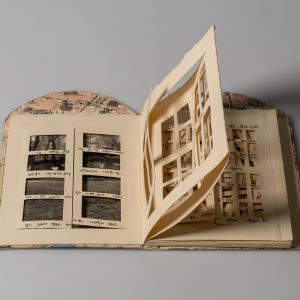 an open book with collaged materials