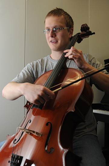 Andrew Buser plays the cello.