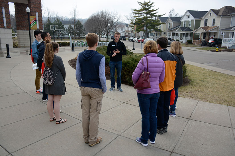A student gives a tour to Prospective students