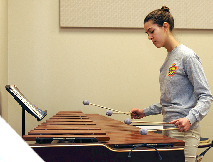 A student practices the marimba