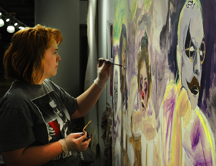Kelly McGuire works on an oil portrait in Fitz Hall.