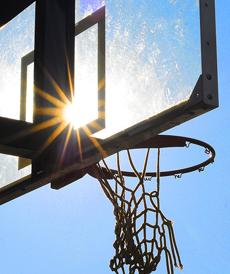 The sun reflects on a backboard at the RecPlex.