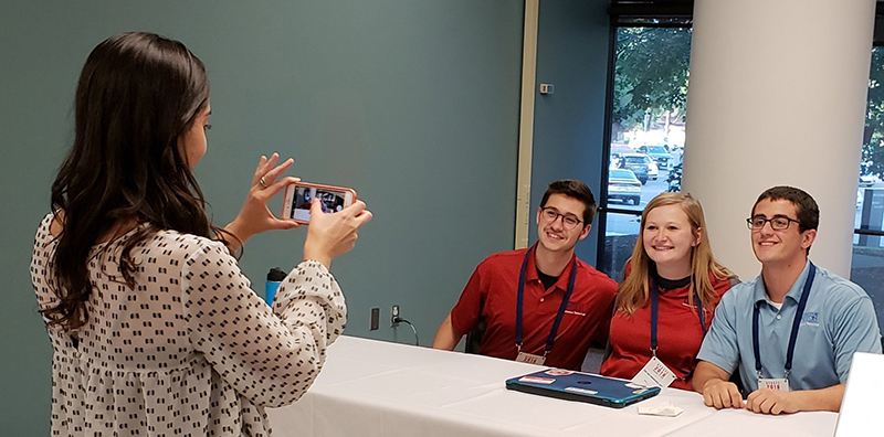 UD Magazine writer Danielle Damon photographs students helping provide IT services during the first 2018 Ohio gubernatorial debate
