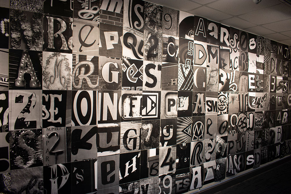 posters of letters hung on a wall
