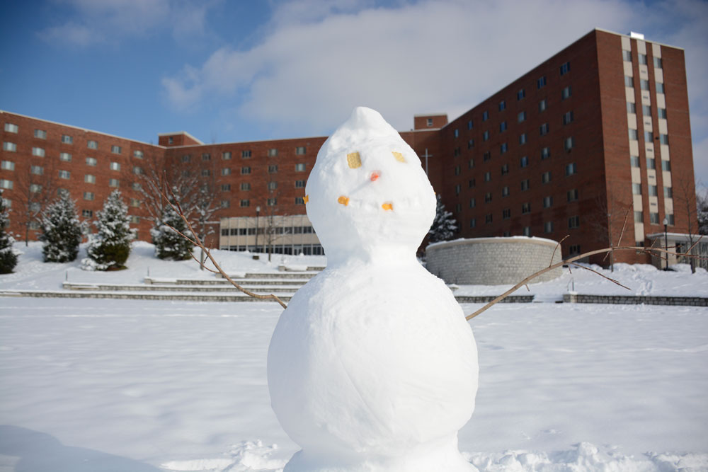A snowman welcomes students back to campus.