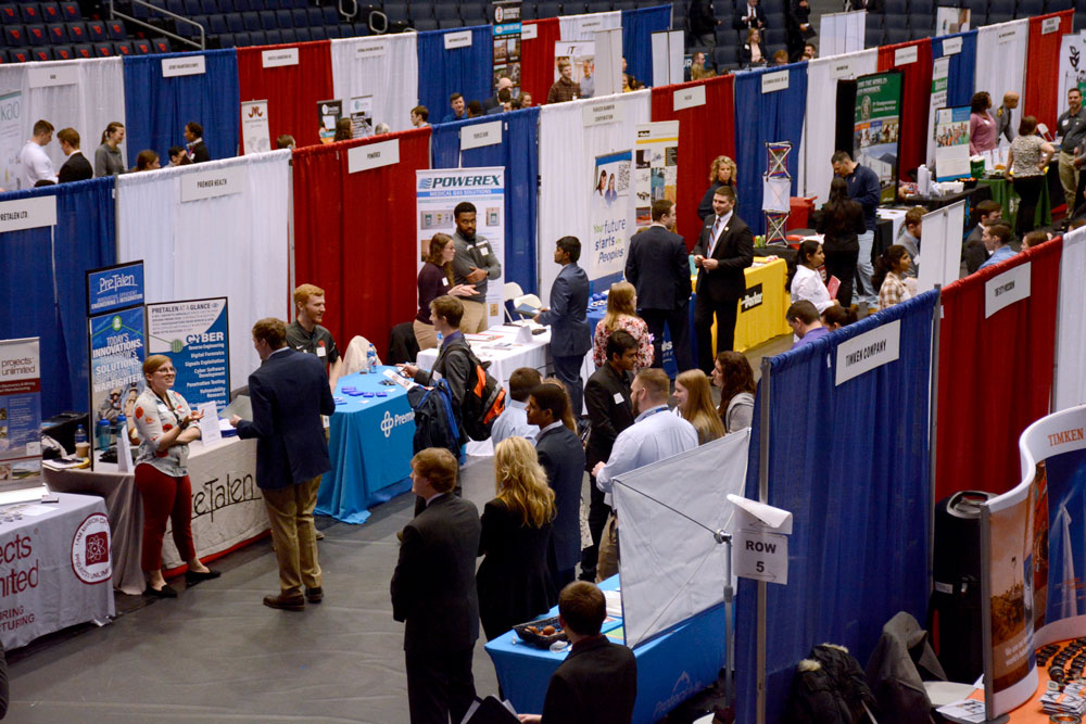 Students visit employers' booths at the Career Fair.