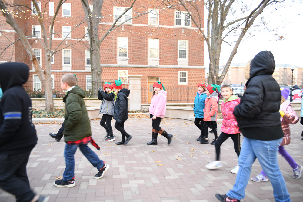 Children walk on campus