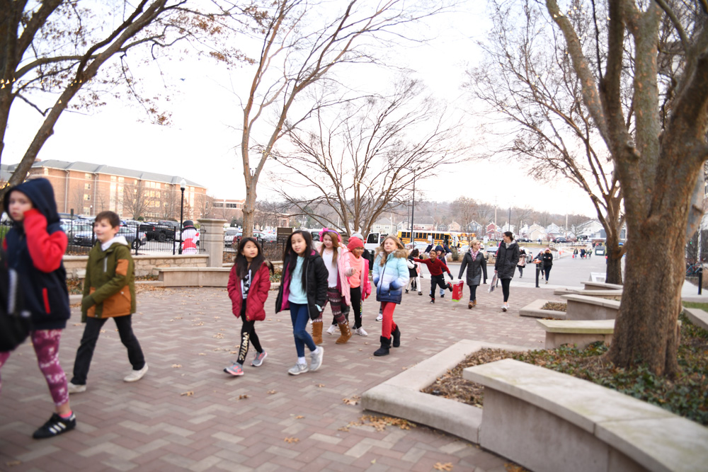Children walk on campus