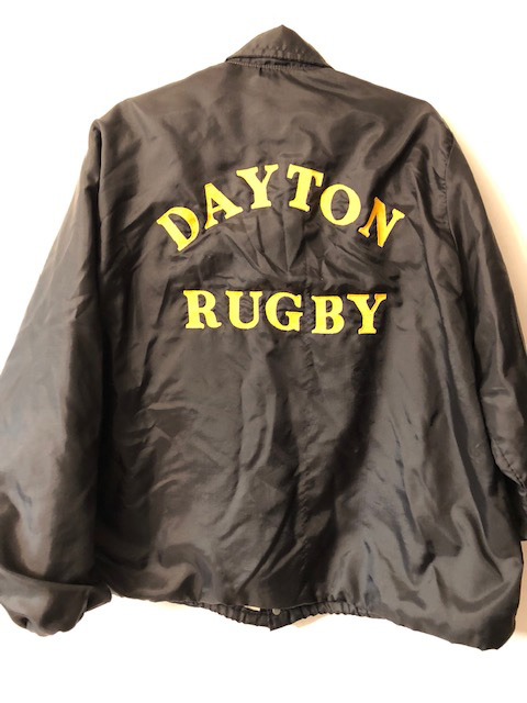 Black jacket with yellow lettering