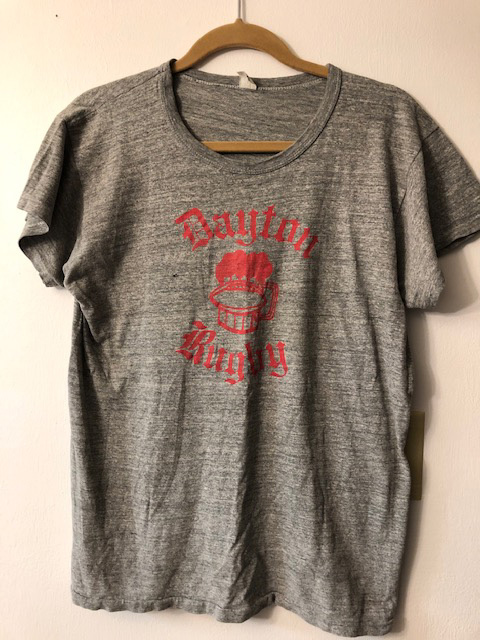 Gray shirt with red lettering