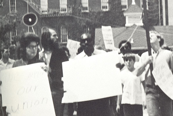 Students carry signs