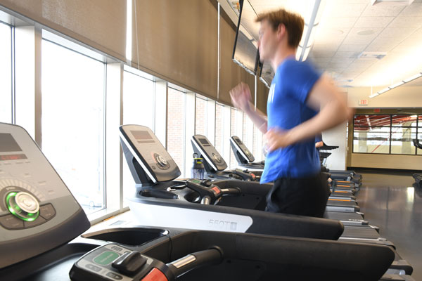 student runs on a treadmill