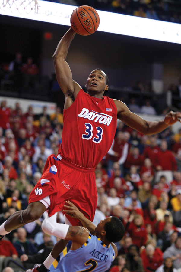 basketball player soaring through the air toward the basket