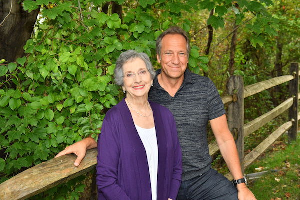Peggy and Mike Rowe sit on a bench.