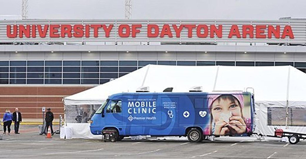 UD Arena with a Premier Health mobile clinic in front of it