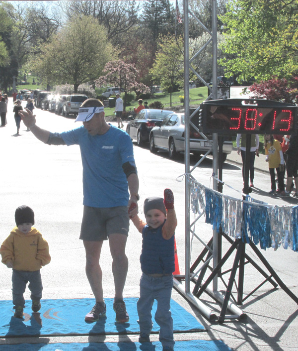 Jeff with his young boys at the finish line of a race