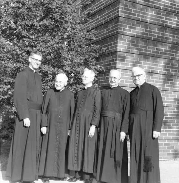 Five Marianist brothers pose together