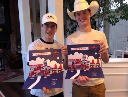 Her sons show off their UD welcome packets