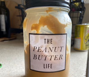 jar with "The peanut butter life" label on it