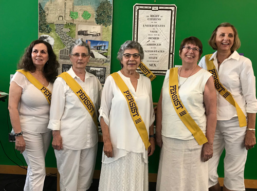 quilters in their suffrage sashes