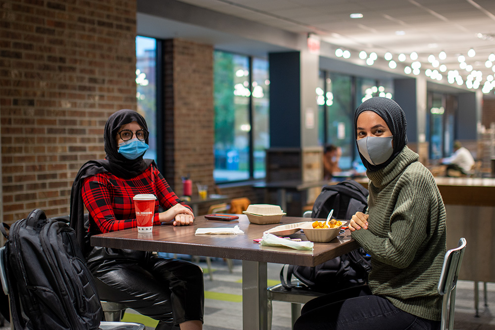 Two students eat breakfast in KU