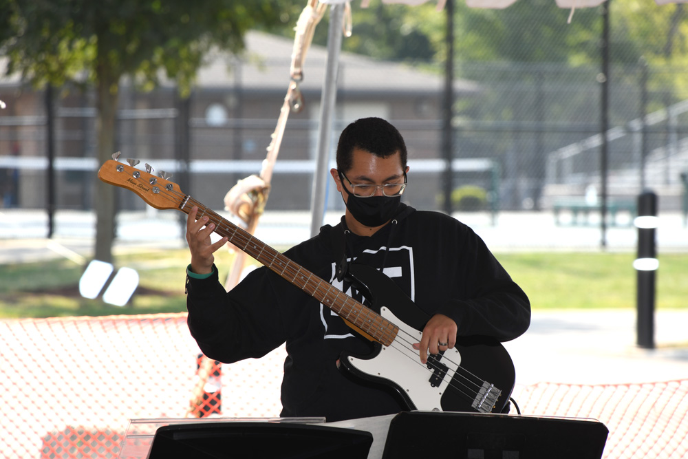 Student plays the bass
