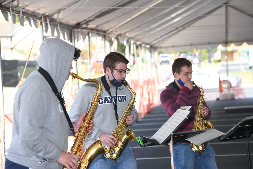Three students play saxophone