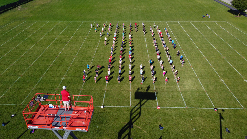 Marching band on the field in a Flying D formation