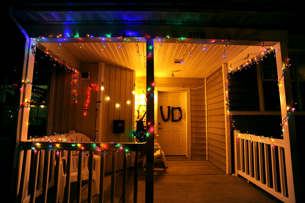 House with candy cane lights on the porch