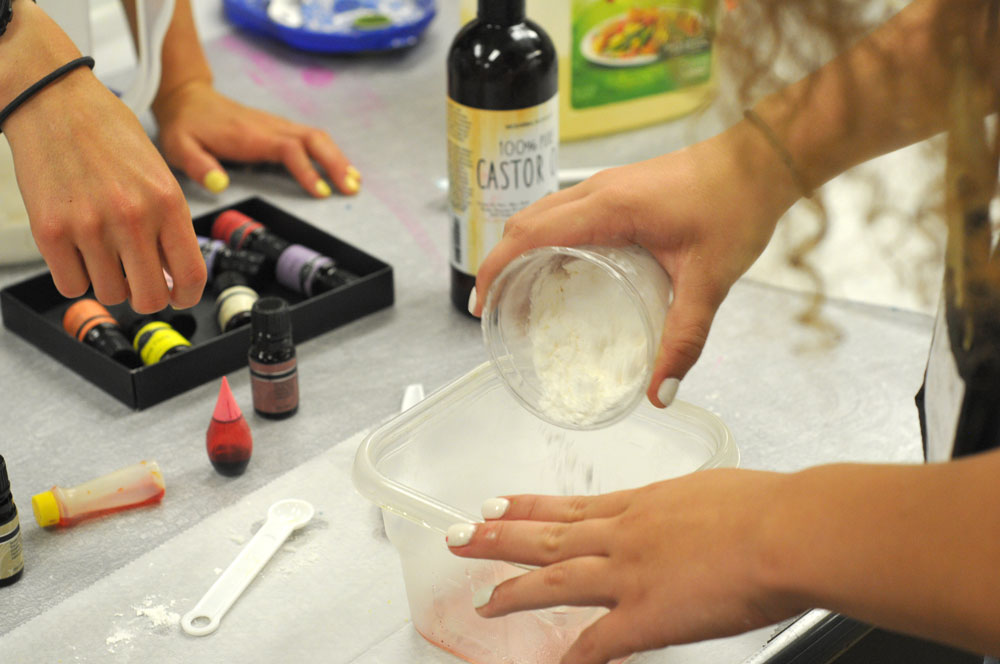 students mix cornstarch with other ingredients