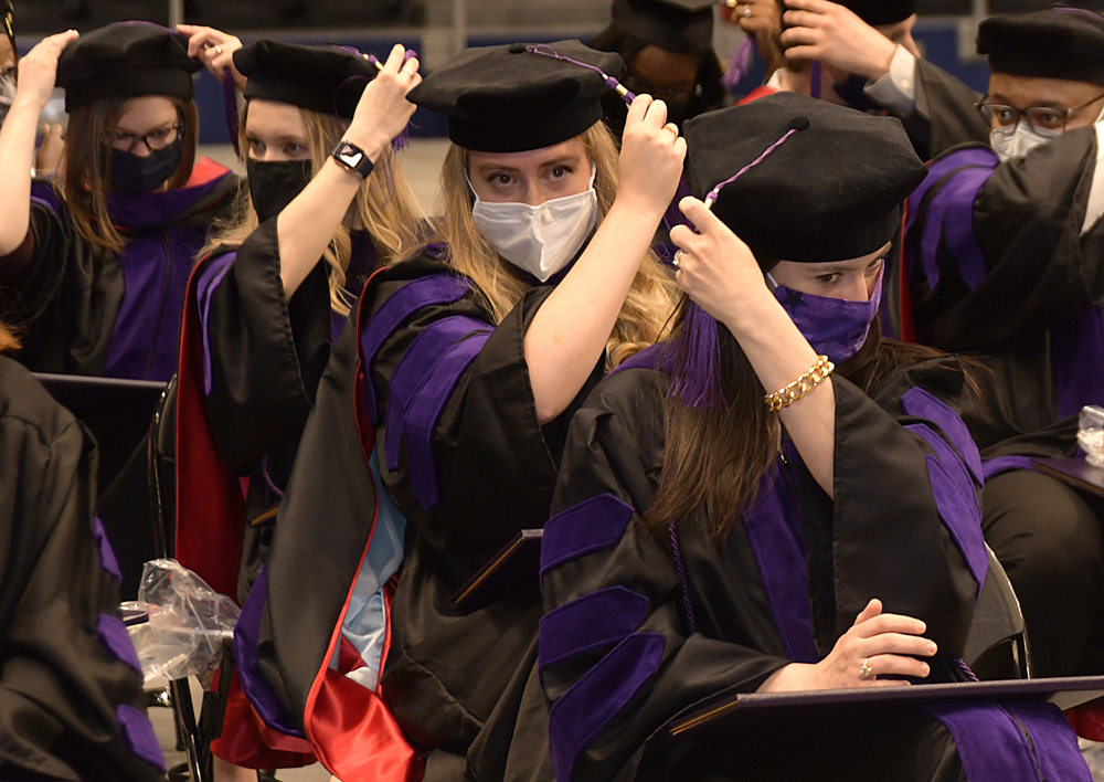 Graduates move their tassels
