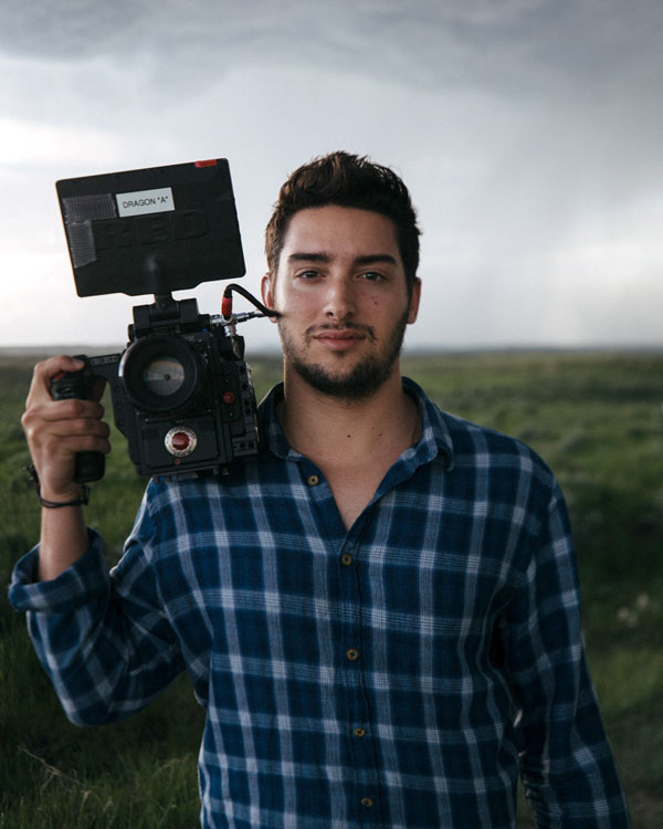 Logan Lambert holds a video camera
