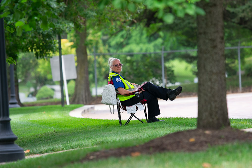 Parking attendant sits in a chair