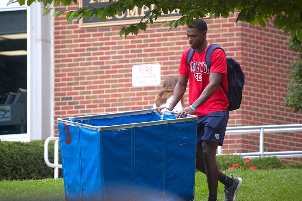 Student pushes an empty cart