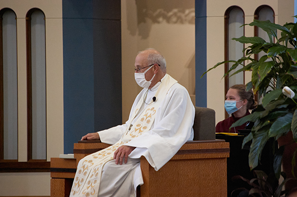 Father Kip Stander, S.M. sits