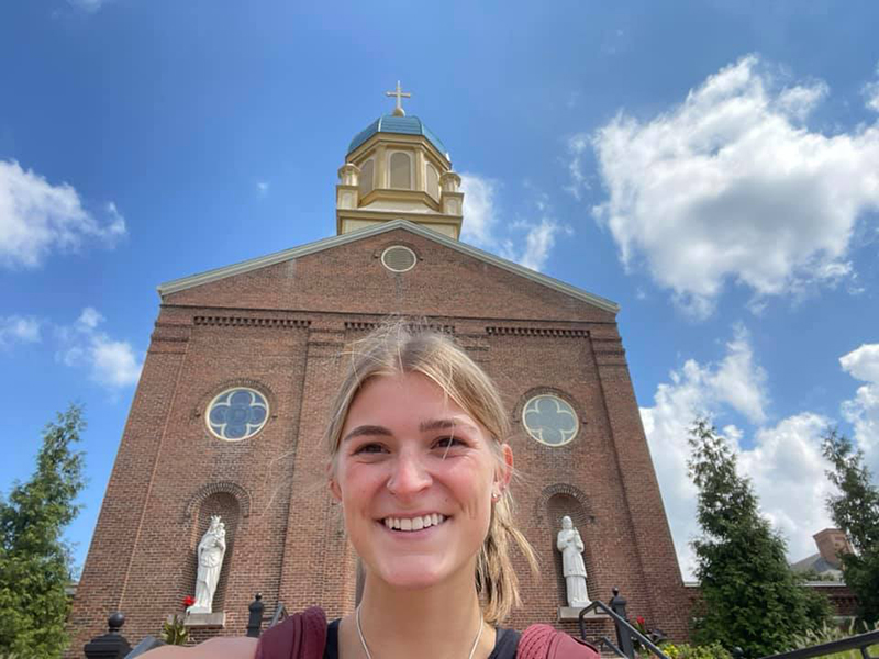 First-year UD student Ryann Mescher poses in front of the UD Chapel.