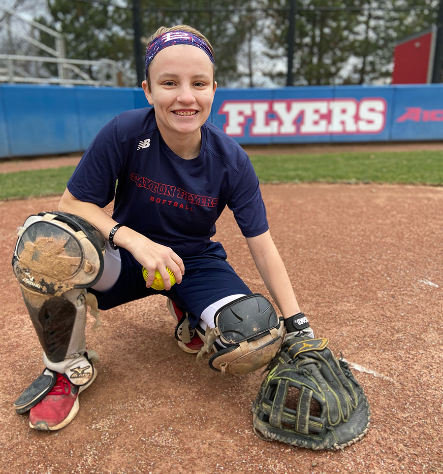 Mary Kate Newman '23 poses on the softball field.