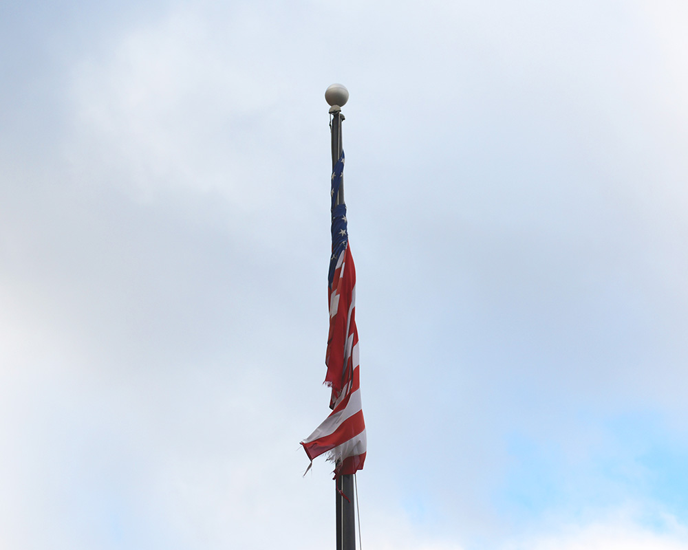American flag wrapped around a flag pole