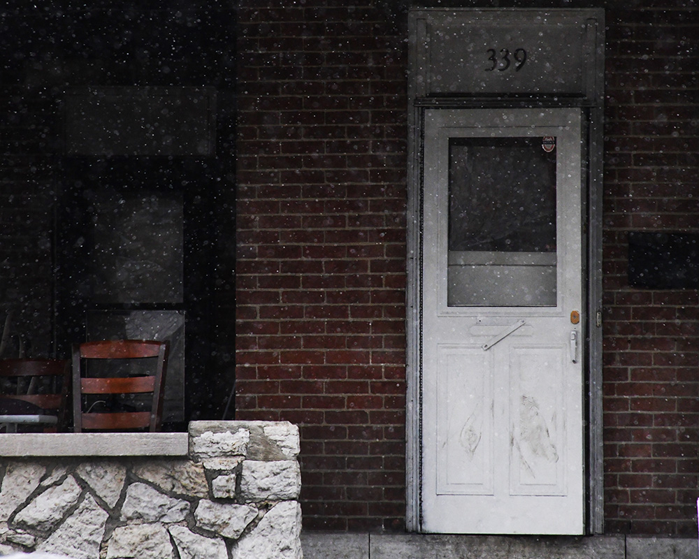 snow flurries outside a student house