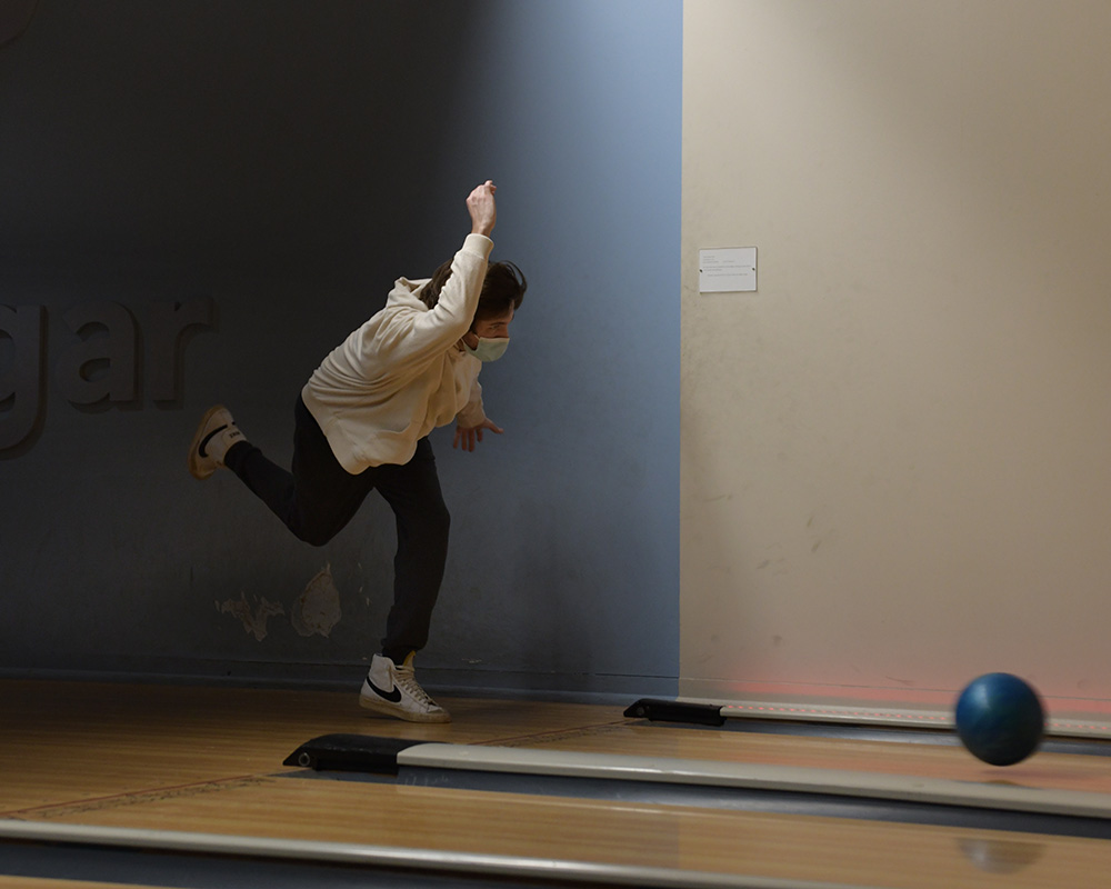 A male student bowling