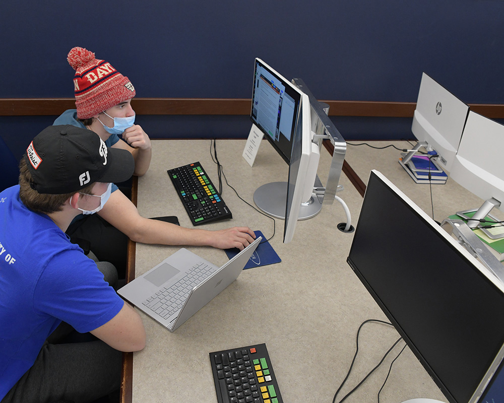 Two male students at a computer