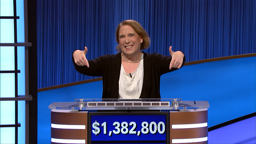 Amy Schneider '02 points to her Jeopardy! winnings score.