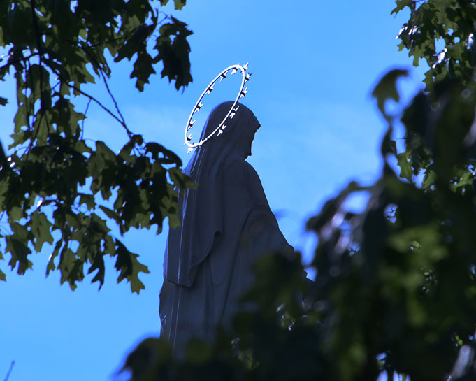 A statue of Mary with a shining halo