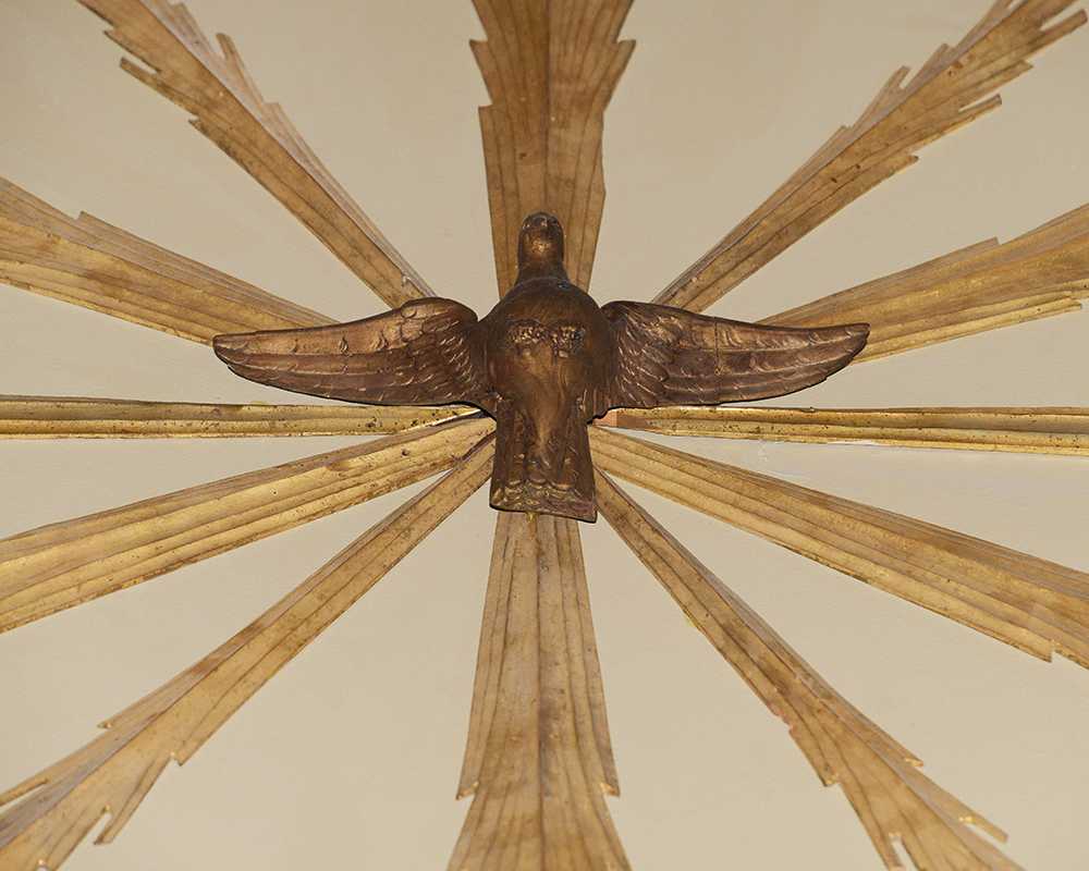 A sculpture of a dove in the chapel