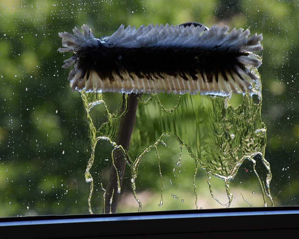 Close-up of a window washing brush