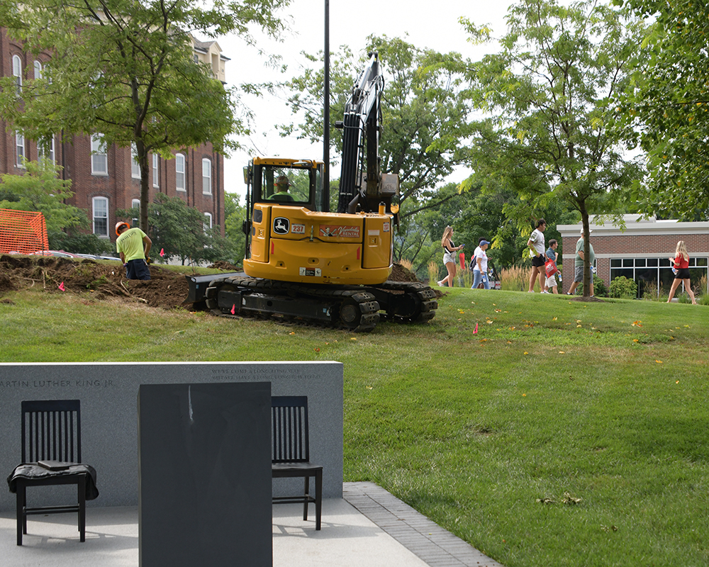 Construction equipment on the campus lawn